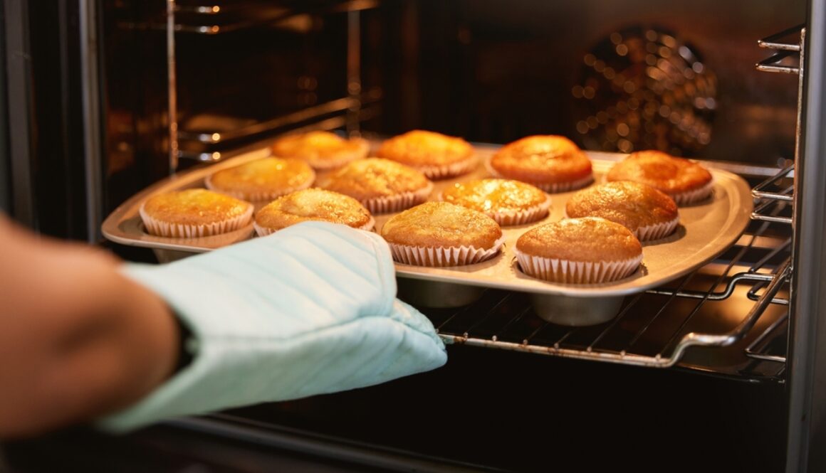 Hand,,Oven,And,Muffins,In,Baking,,Food,Or,Cooking,Sweet